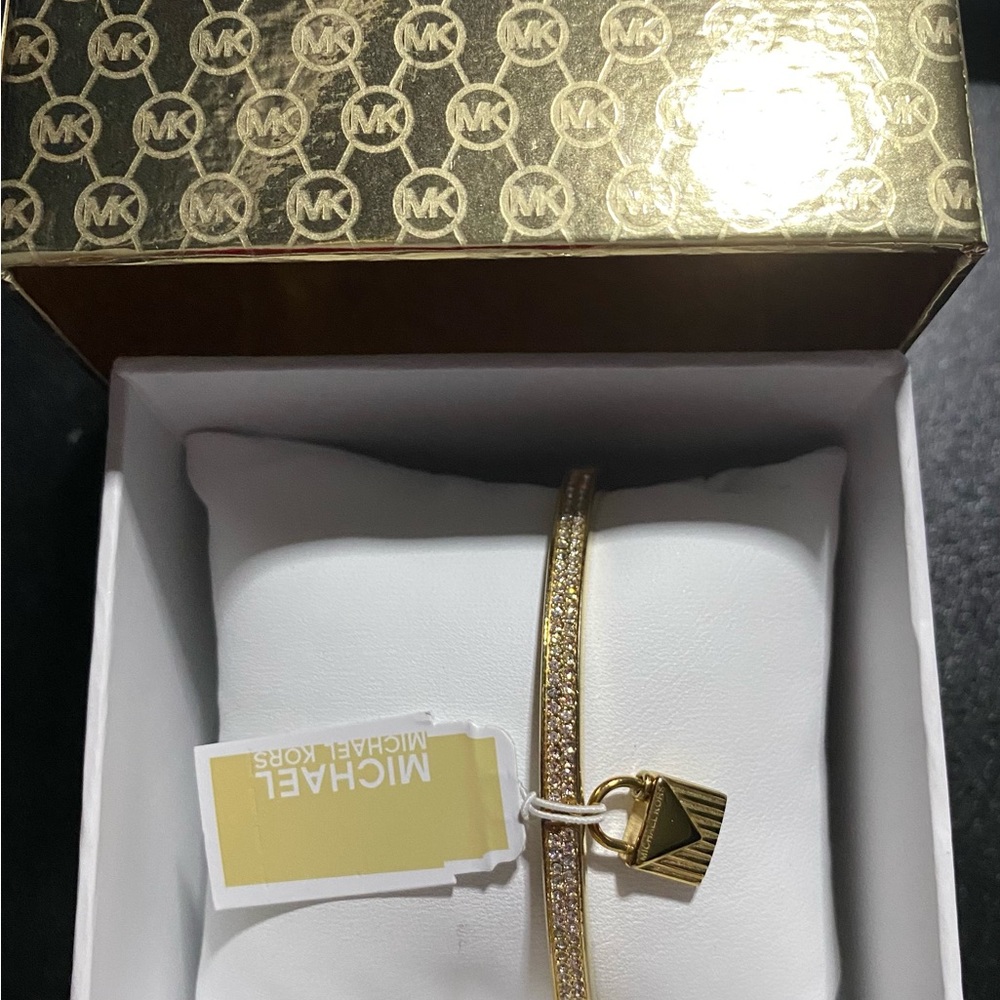 MK crystal accent bangle bracelet gold tone.